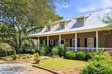 Located beneath breathtaking live oaks in the heart of the - photo 2