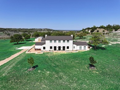 Nestled on 4.087 acres in the Texas Hill Country, this modern