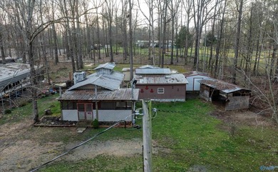 Make this cabin-style tiny home your lake area retreat. It sits - photo 3