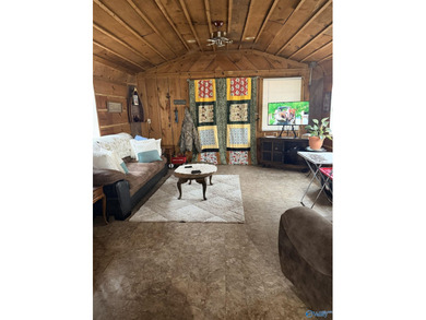 Make this cabin-style tiny home your lake area retreat. It sits - photo 7