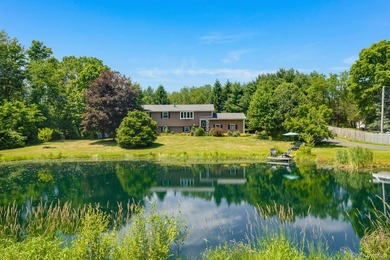 Tucked away in a private, park-like setting, this stunning - photo 3