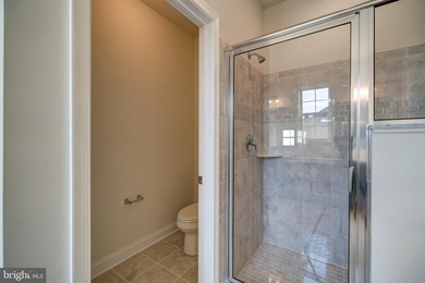 The Legend features a 1st-floor owner suite with a grand - photo 12