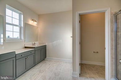 The Legend features a 1st-floor owner suite with a grand - photo 14