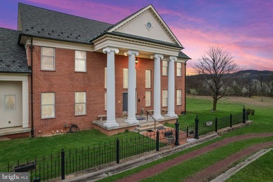 This one-of-a-kind custom-built estate offers an incredible - photo 1