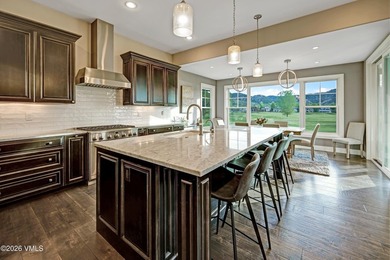 Welcome home to the coveted Eagle Ranch community, where - photo 8