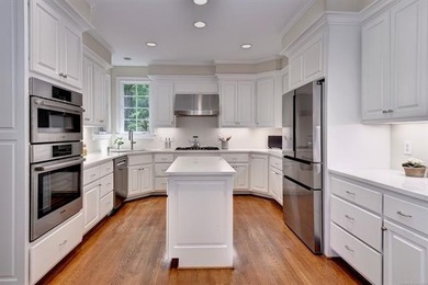 This all-brick colonial sits on a private end lot and offers a - photo 20
