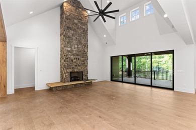 The Hearth is a waterfront home designed around the moments that - photo 15