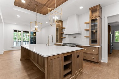 The Hearth is a waterfront home designed around the moments that - photo 16