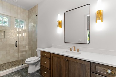 The Hearth is a waterfront home designed around the moments that - photo 21