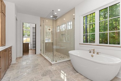 The Hearth is a waterfront home designed around the moments that - photo 25