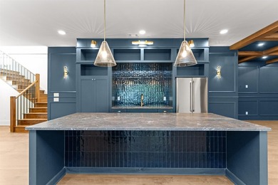 The Hearth is a waterfront home designed around the moments that - photo 33