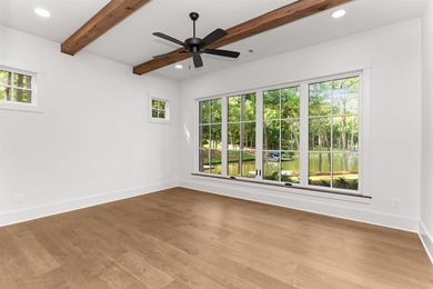 The Hearth is a waterfront home designed around the moments that - photo 35