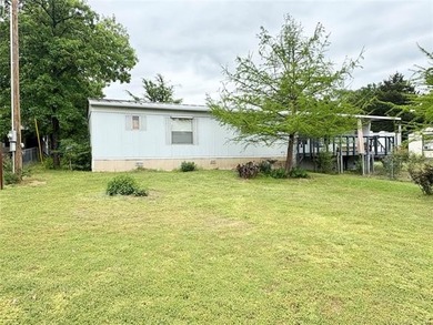 This clean and tidy 2 bed, 2 bath home is located in the highly - photo 1