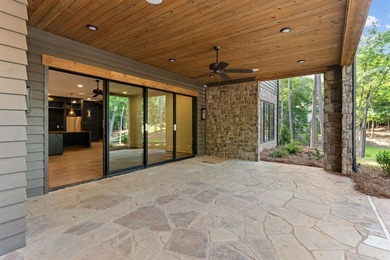 The Hearth is a waterfront home designed around the moments that - photo 43