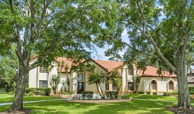 Set on an elevated corner homesite within Isleworth, this - photo 1