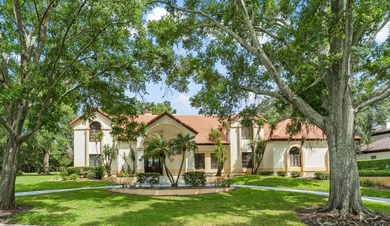 Set on an elevated corner homesite within Isleworth, this - photo 2