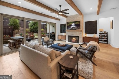 Tucked in the heart of Bridgemill, this luxury townhome lives - photo 3