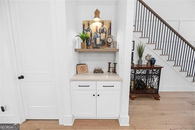 Tucked in the heart of Bridgemill, this luxury townhome lives - photo 6