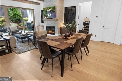 Tucked in the heart of Bridgemill, this luxury townhome lives - photo 7