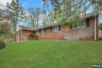 Welcome to this charming brick ranch, beautifully set on 1.58 - photo 1