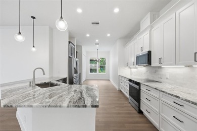 Welcome to this stunning BRAND-NEW CUSTOM-BUILT home in the - photo 9