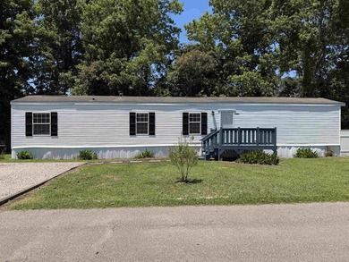 Two-bedroom, two-bathroom Fleetwood mobile home in Foxfire - photo 1