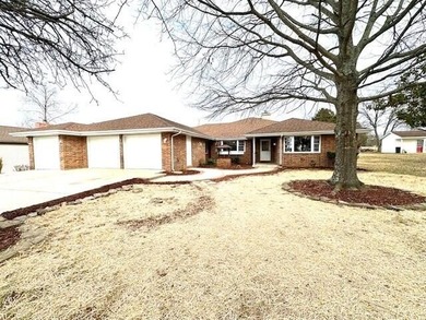 Spacious All Brick Ranch Home with a 3 Car Garage in the Heart