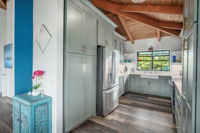 Nestled in the heart of Kilauea, this thoughtfully designed and - photo 17