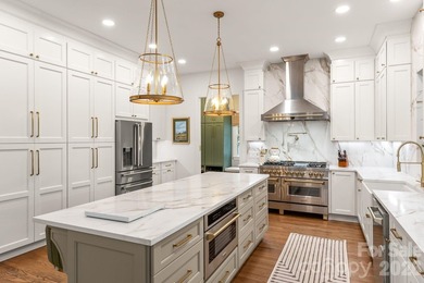 From the oversized Mahogany front doors to the designer-curated - photo 13