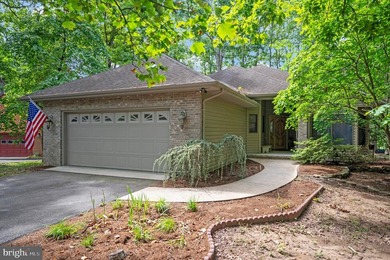 Tucked in the cul-de-sac & sitting on a wooded lot give this - photo 1