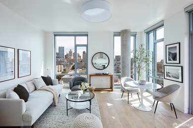 Situated on the 11th floor, this luminous two-bedroom, two-bath - photo 1
