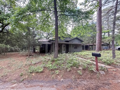Tucked among the tall trees on beautiful Lake Franklin in the - photo 2