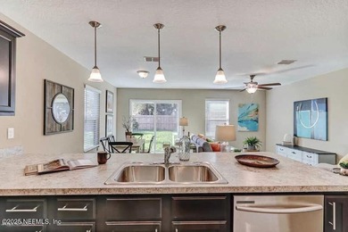 This nearly new home has 3 bedrooms and 2.5 baths with an open - photo 2