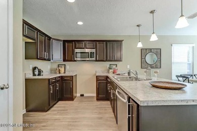 This nearly new home has 3 bedrooms and 2.5 baths with an open - photo 9
