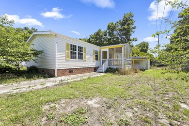 Welcome to the beach! This charming 3-bedroom, 2-bath home - photo 1