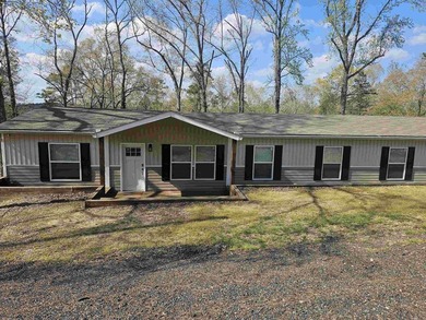 Double wide mobile home offering 5 bedrooms and 3 bathrooms on - photo 1