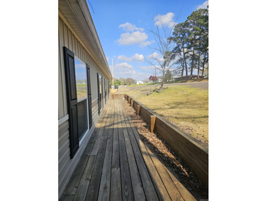 Double wide mobile home offering 5 bedrooms and 3 bathrooms on - photo 2