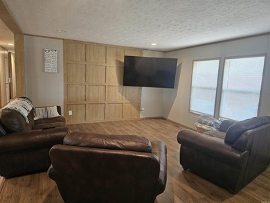 Double wide mobile home offering 5 bedrooms and 3 bathrooms on - photo 4