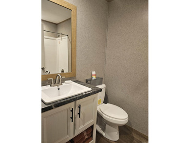 Double wide mobile home offering 5 bedrooms and 3 bathrooms on - photo 6