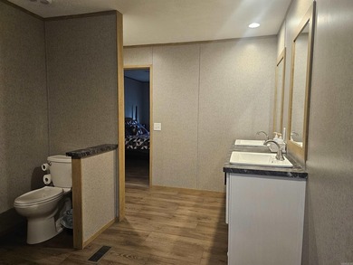 Double wide mobile home offering 5 bedrooms and 3 bathrooms on - photo 8