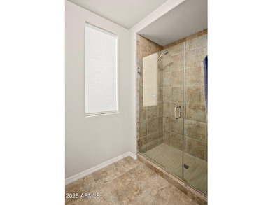 This highly upgraded North Scottsdale gated condominium offers