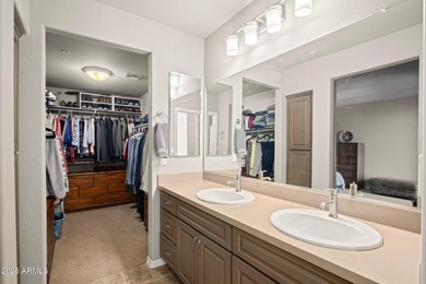 This highly upgraded North Scottsdale gated condominium offers