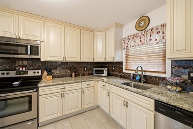 Refined comfort meets effortless Long Island living in this - photo 8