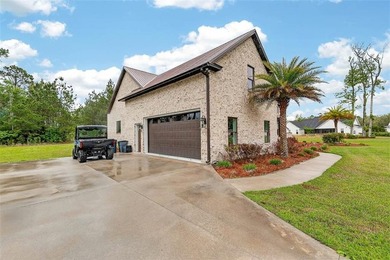 Beautiful brick home situated on nearly 3 acres in the gated - photo 11