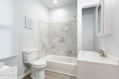 Completely renovated and move-in ready! This stunning 3-bedroom - photo 12
