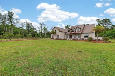 Beautiful brick home situated on nearly 3 acres in the gated - photo 16