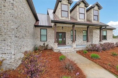 Beautiful brick home situated on nearly 3 acres in the gated - photo 31