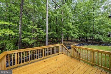 Nestled in the serene Lake of the Woods community, this stunning - photo 9