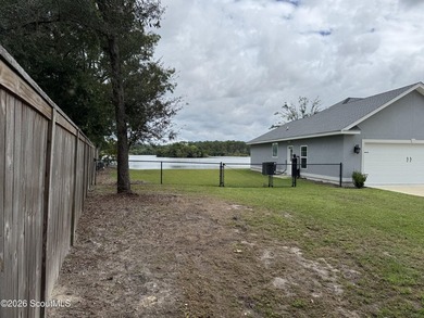 House features a large lot on approximately 30 Acre Lake, Stucco - photo 27