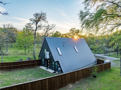 Elevated open water views pair with lake access at this A-frame - photo 24